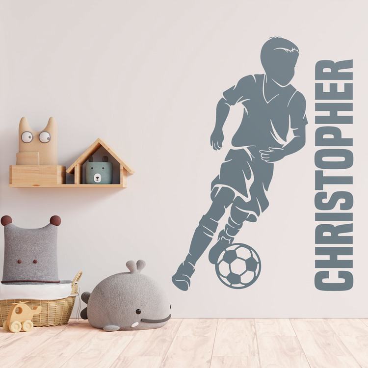 Vinilos Infantiles: Silueta de niño futbolista con nombre personalizad