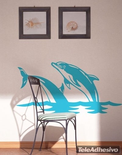 Vinilos Decorativos: Pareja de delfines saltan en el mar