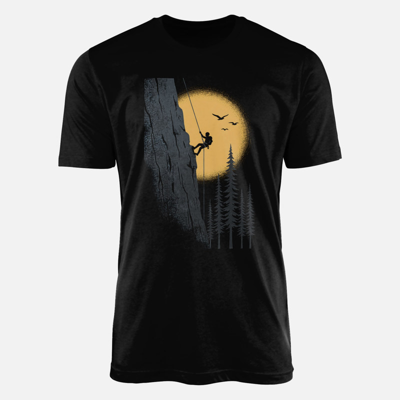 Camisetas: Escalador en acantilado al atardecer
